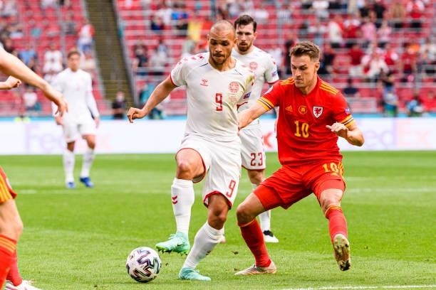 Martin Braithwaite of Denmark plays against Aaron Ramsey of Wales during the UEFA Euro 2020 Championship Round of 16 match between Wales and Denmark...