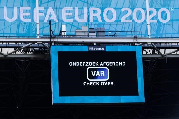 Big screen shows a VAR result during the UEFA Euro 2020 Championship Round of 16 match between Wales and Denmark at Johan Cruijff Arena on June 26,...
