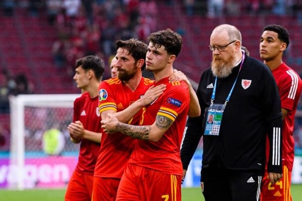 Joe Allen and Neco Williams of Wales were crushed after been defeated by Denmark during the UEFA Euro 2020 Championship Round of 16 match between...