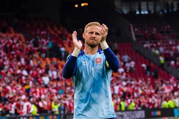 Goalkeeper Kasper Schmeichel of Denmark celebrates with his teammates after winning Wales during the UEFA Euro 2020 Championship Round of 16 match...