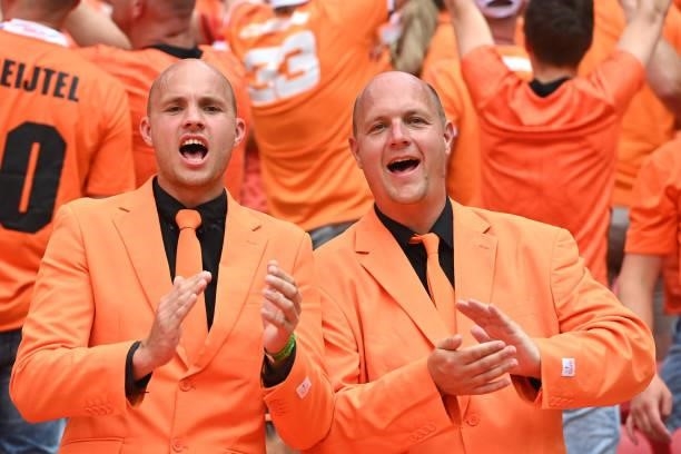 Netherlands fans wearing suits enjoy the pre match atmosphere prior to the UEFA Euro 2020 Championship Round of 16 match between Netherlands and...