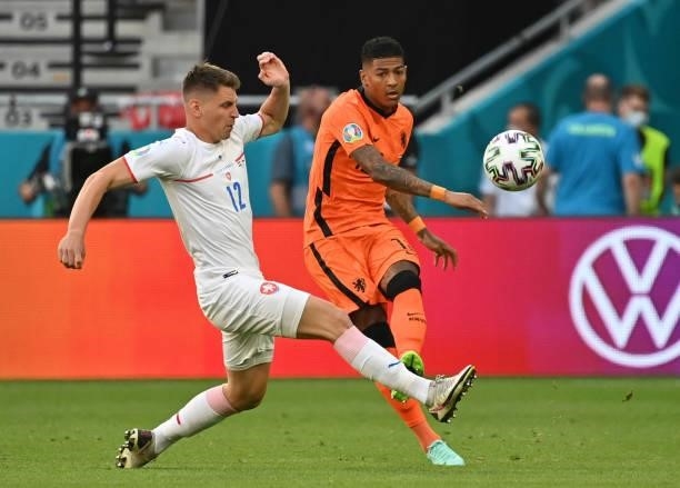 Patrick van Aanholt of Netherlands passes the ball whilst under pressure from Lukas Masopust of Czech Republic during the UEFA Euro 2020 Championship...