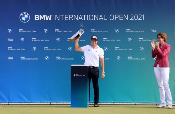 Viktor Hovland of Norway is presented with the winners trophy by Ilka Horstmeier, Member of the Board of Management of BMW AG after the final round...