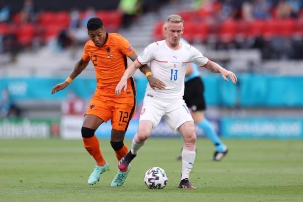 Petr Sevcik of Czech Republic battles for possession with Patrick van Aanholt of Netherlands during the UEFA Euro 2020 Championship Round of 16 match...
