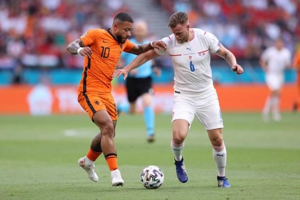 Tomas Kalas of Czech Republic is challenged by Memphis Depay of Netherlands during the UEFA Euro 2020 Championship Round of 16 match between...
