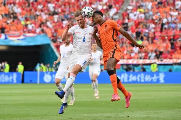 Denzel Dumfries of Netherlands competes for a header with Tomas Kalas of Czech Republic during the UEFA Euro 2020 Championship Round of 16 match...