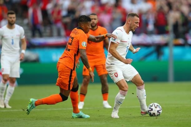 Vladimir Coufal of Czech Republic makes a pass whilst under pressure from Patrick van Aanholt of Netherlands during the UEFA Euro 2020 Championship...
