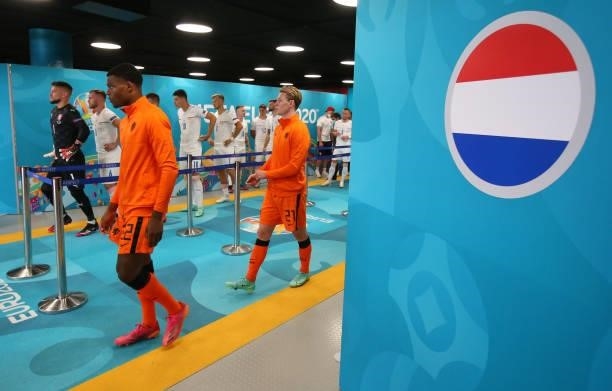Denzel Dumfries and Frenkie de Jong of Netherlands take to the field prior to the UEFA Euro 2020 Championship Round of 16 match between Netherlands...