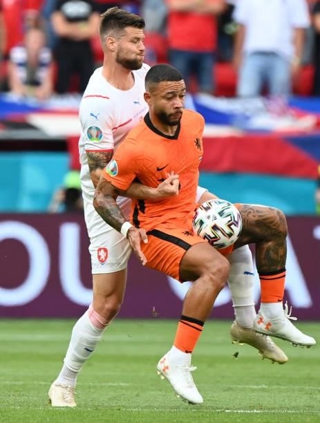 Memphis Depay of Netherlands battles for possession with Ondrej Celustka of Czech Republic during the UEFA Euro 2020 Championship Round of 16 match...