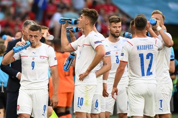 Patrik Schick and Tomas Holes of Czech Republic take a drink with teammates during the UEFA Euro 2020 Championship Round of 16 match between...