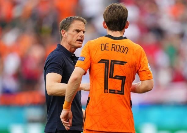 Frank de Boer, Head Coach of Netherlands speaks with Marten de Roon of Netherlands during the UEFA Euro 2020 Championship Round of 16 match between...