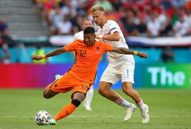 Patrick van Aanholt of Netherlands looks to pass the ball whilst under pressure from Antonin Barak of Czech Republic during the UEFA Euro 2020...