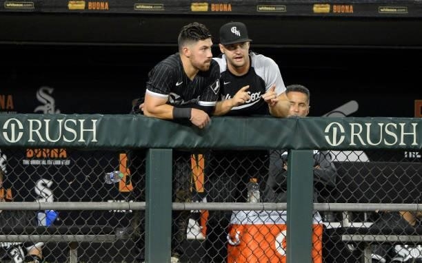 Danny Mendick and Adam Engel of the Chicago White Sox look on against the Seattle Mariners on June 25, 2021 at Guaranteed Rate Field in Chicago,...