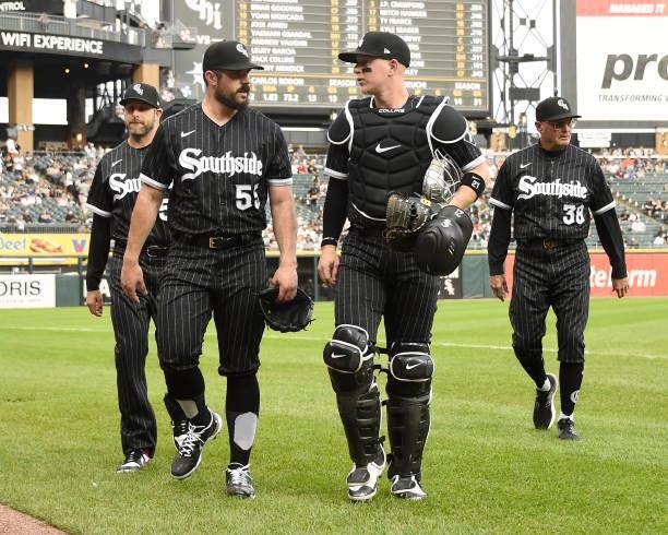 Carlos Rodon and Zack Collins of the Chicago White Sox walk in from the bullpen prior to the game against the Seattle Mariners on June 25, 2021 at...