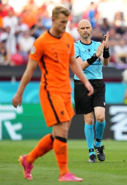 Match Referee, Sergei Karasev reacts after showing Matthijs de Ligt of Netherlands a red card following a VAR review during the UEFA Euro 2020...