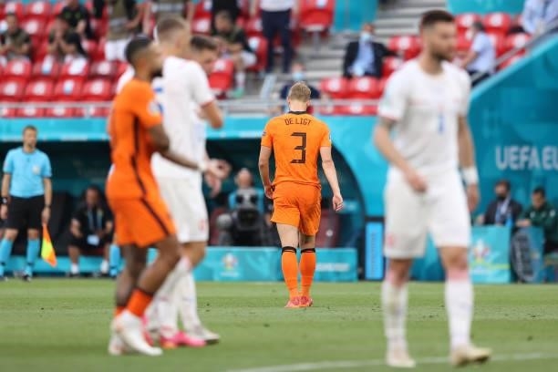 Matthijs de Ligt of Netherlands leaves the field after being shown a red card following a VAR review during the UEFA Euro 2020 Championship Round of...