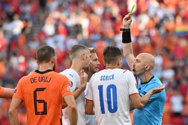 Patrik Schick and teammates of Czech Republic protest to Match Referee, Sergei Karasev as Matthijs de Ligt of Netherlands is shown a yellow card that...