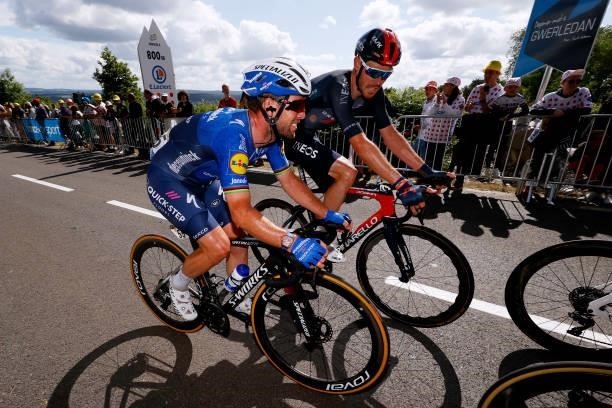 Mark Cavendish of The United Kingdom and Team Deceuninck - Quick-Step & Luke Rowe of The United Kingdom and Team INEOS Grenadiers during the 108th...