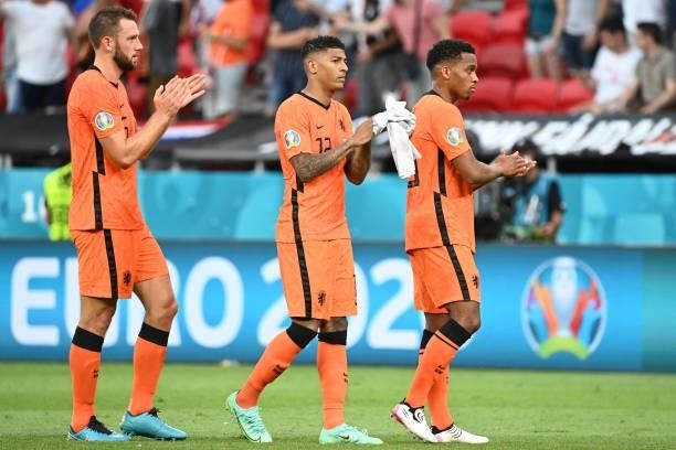 Stefan de Vrij, Patrick van Aanholt and Jurrien Timber of Netherlands applaud the fans following defeat in the UEFA Euro 2020 Championship Round of...