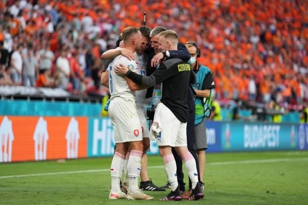 Jaroslav Silhavy, Head Coach of Czech Republic celebrates their side's victory with Vladimir Coufal of Czech Republic and their team mates after the...