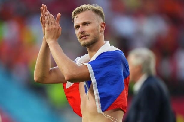 Antonin Barak of Czech Republic wears a flag as he applauds the fans following victory in the UEFA Euro 2020 Championship Round of 16 match between...