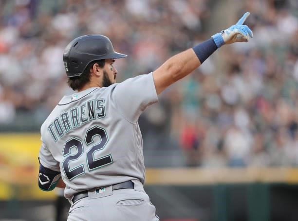 Luis Torrens of the Seattle Mariners celebrates his two run home run as he runs the bases against the Chicago White Sox at Guaranteed Rate Field on...
