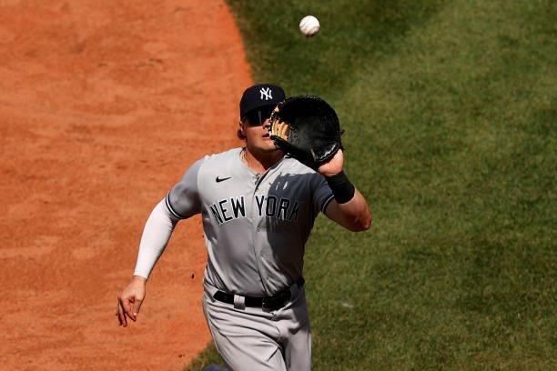 Luke Voit of the New York Yankees catches a fly ball hit by Enrique Hernandez of the Boston Red Sox during the sixth inning at Fenway Park on June...