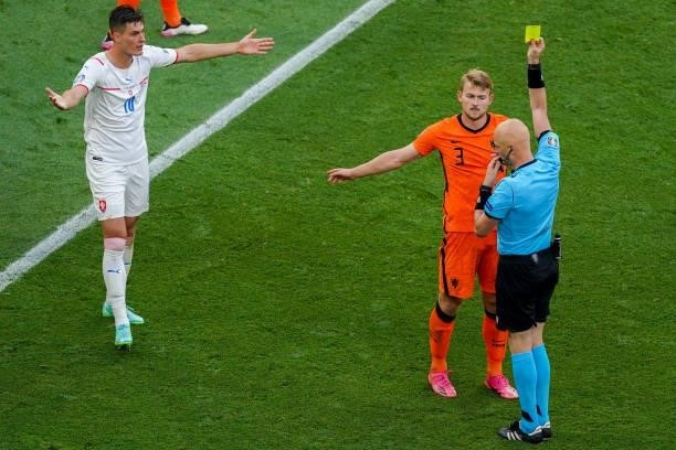 Referee Sergei Karasev with a yellow card for Matthijs de Ligt of the Netherlands, which was later changed into a direct red card during the UEFA...