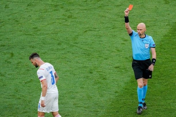 Referee Sergei Karasev with a direct red card for Matthijs de Ligt of the Netherlands after checking the VAR during the UEFA Euro 2020: Round of 16...