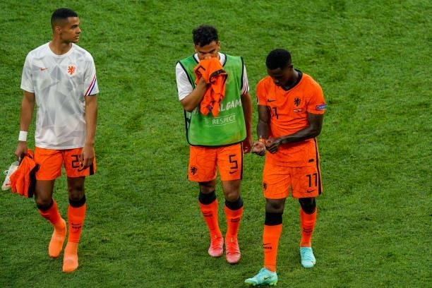 Cody Gakpo of the Netherlands, Owen Wijndal of the Netherlands and Quincy Promes of the Netherlands look disappointed after the UEFA Euro 2020: Round...