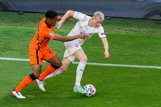 Jurrien Timber of the Netherlands battles for possession with Michael Krmencik of Czech Republic during the UEFA Euro 2020: Round of 16 match between...