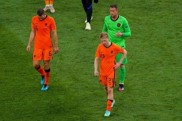Stefan de Vrij of the Netherlands, Frenkie de Jong and goalkeeper Maarten Stekelenburg of the Netherlands look disappointed after the UEFA Euro 2020:...