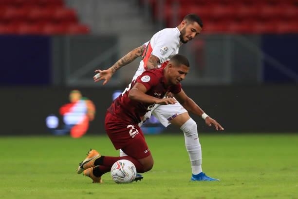 Edson Castillo of Venezuela and Sergio Peña of Peru fight for the ball during a Group B Match between Venezuela and Peru as part of Copa America...