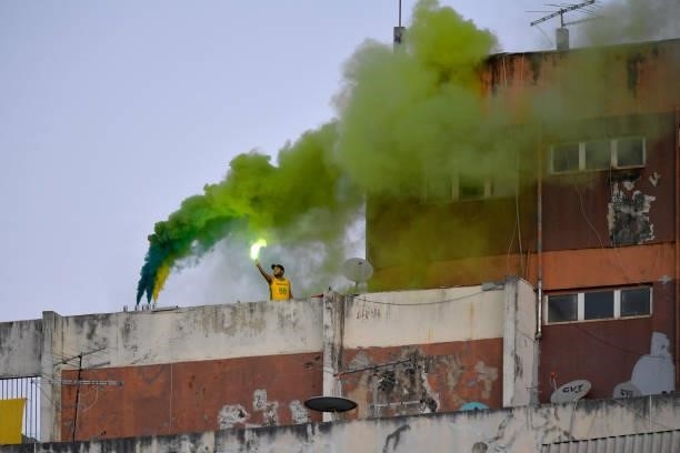 Fan lights a flare from a building before a group B match between Brazil and Ecuador as part of Copa America Brazil 2021 at Estadio Olimpico on June...