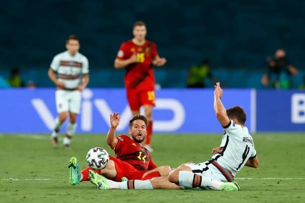 Dries Mertens of Belgium battles for possession with Ruben Dias of Portugal during the UEFA Euro 2020 Championship Round of 16 match between Belgium...