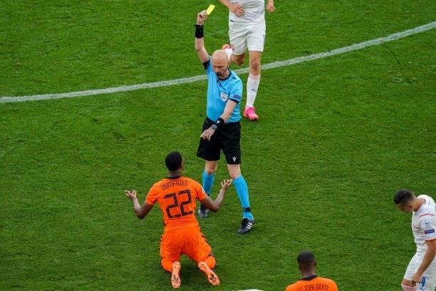 Referee Sergei Karasev with a yellow card for Denzel Dumfries of the Netherlands during the UEFA Euro 2020: Round of 16 match between Netherlands and...