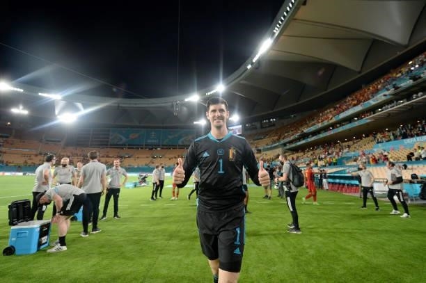 Thibaut Courtois of Belgium celebrates after victory in the UEFA Euro 2020 Championship Round of 16 match between Belgium and Portugal at Estadio La...