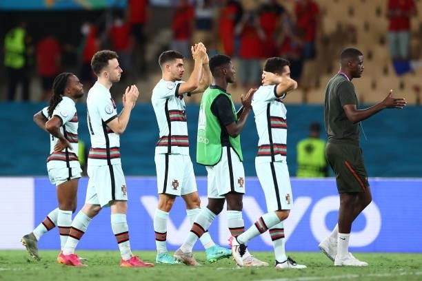 Players of Portugal look dejected as they applaud the fans after the UEFA Euro 2020 Championship Round of 16 match between Belgium and Portugal at...