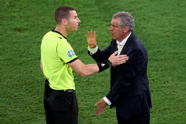 Fernando Santos, Manager of Portugal discusses with fourth official referee Georgi Kabakov during the UEFA Euro 2020 Championship Round of 16 match...