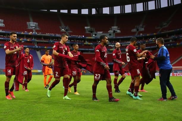 Payers of Venezuela take off their jackets before a Group B Match between Venezuela and Peru as part of Copa America Brazil 2021 at Mane Garrincha...