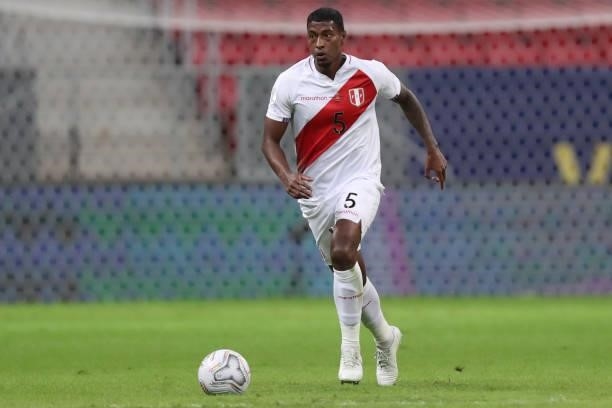 Miguel Araujo of Peru drives the ball during a Group B Match between Venezuela and Peru as part of Copa America Brazil 2021 at Mane Garrincha Stadium...