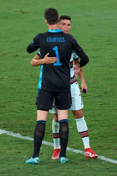Thibaut Courtois of Belgium consoles Cristiano Ronaldo of Portugal following the UEFA Euro 2020 Championship Round of 16 match between Belgium and...