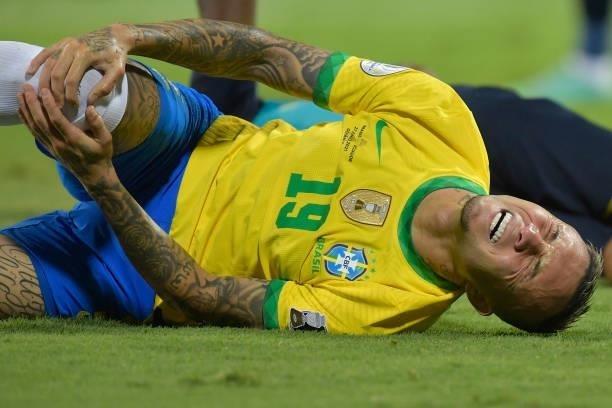 Everton of Brazil reacts after being injured during a group B match between Brazil and Ecuador as part of Copa America Brazil 2021 at Estadio...