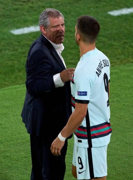 Andre Silva of Portugal speaks with Fernando Santos, Manager of Portugal during the UEFA Euro 2020 Championship Round of 16 match between Belgium and...