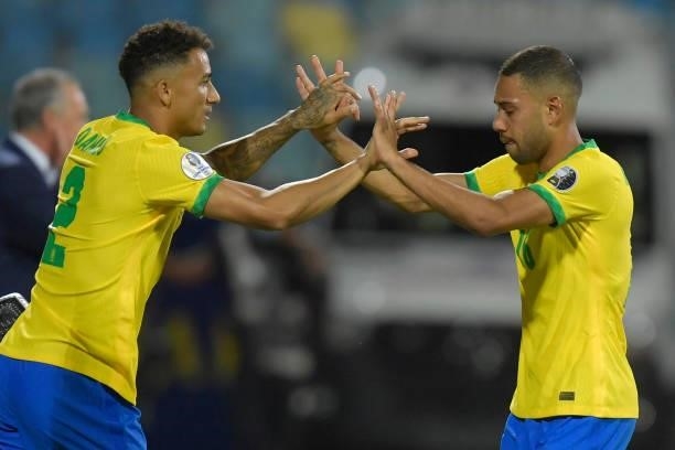 Renan Lodi of Brazil greets teammate Danilo da Silva after being replaced during a group B match between Brazil and Ecuador as part of Copa America...