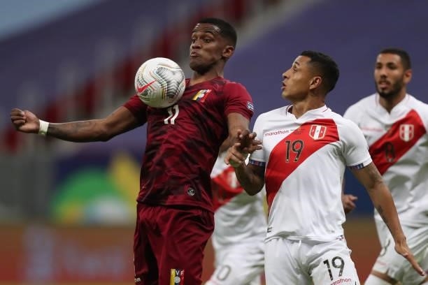 Sergio Cordova of Venezuela and Yoshimar Yotun of Peru fight for the ball during a Group B Match between Venezuela and Peru as part of Copa America...