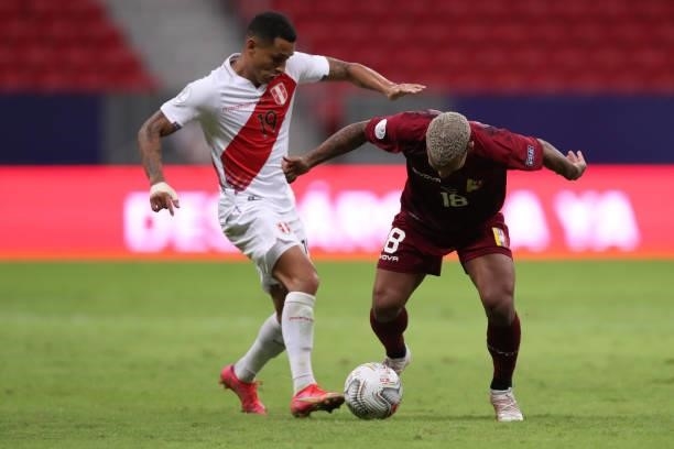 Romulo Otero of Venezuela and Yoshimar Yotun of Peru fight for the ball during a Group B Match between Venezuela and Peru as part of Copa America...