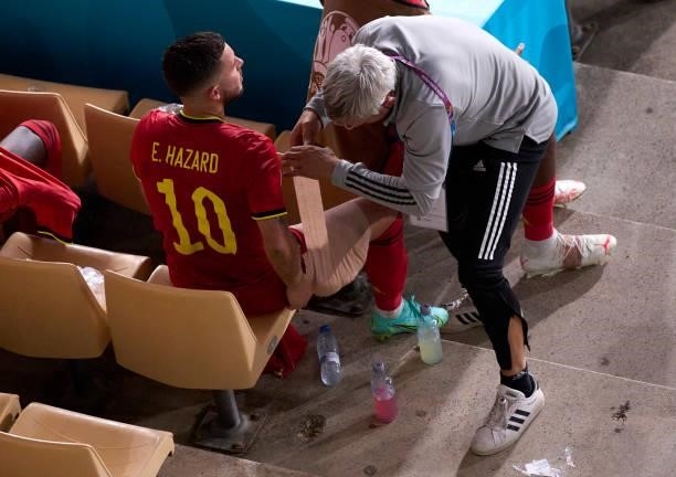Eden Hazard of Belgium receives medical treatment during the UEFA Euro 2020 Championship Round of 16 match between Belgium and Portugal at Estadio La...