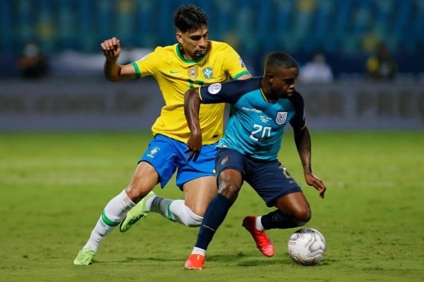 Lucas Paqueta of Brazil competes for the ball with Sebastian Mendez of Ecuador during a group B match between Brazil and Ecuador as part of Copa...