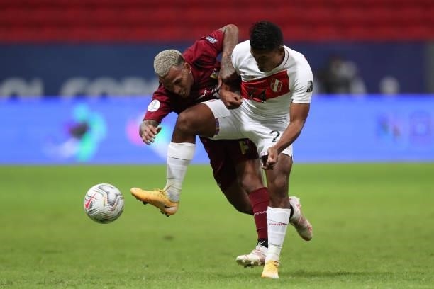 Raziel Garcia of Peru and Romulo Otero of Venezuela fight for the ball during a Group B Match between Venezuela and Peru as part of Copa America...